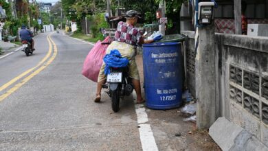 colourful recycling bins outside homes