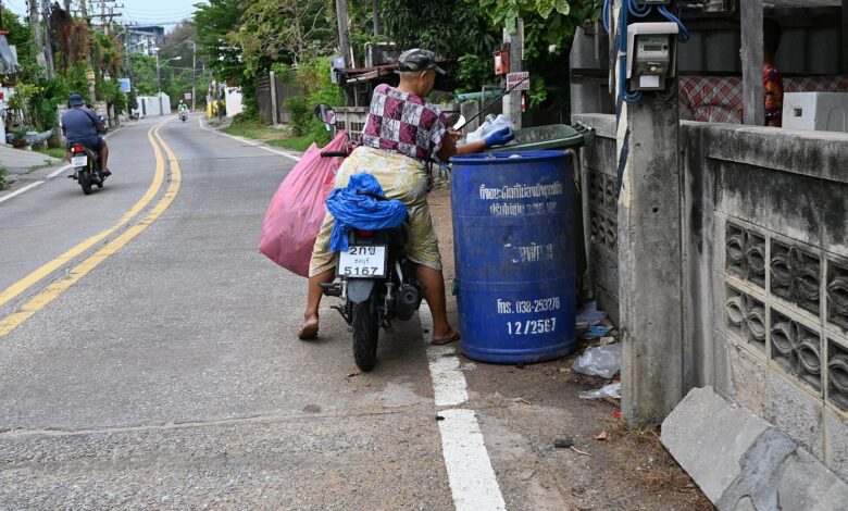 colourful recycling bins outside homes