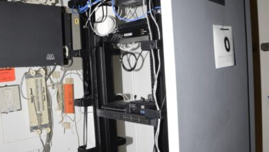 blue network cables organised in a server room