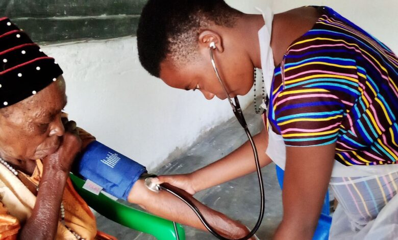 nurse checking a patient's blood pressure